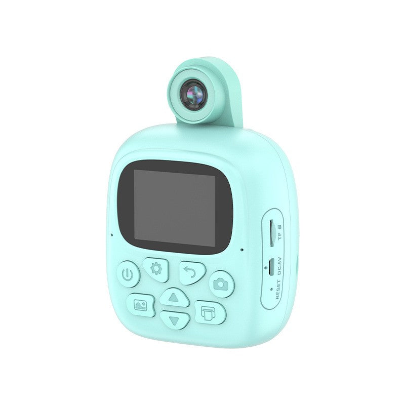 Set Camera Instantanee pentru Copii, Smart, Camera 180° Selfie, Ecran HD 2'', 24MP, 720P Video, 1200 mAh, cu Functie de Printare Alb-Negru, cablu USB-C, Bluetooth, Compatibil iOS/Android, Imprimare APP, Model Dino, Turcoaz